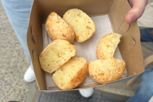 Overhead view of a box of pao di quiejo (a Brazilian cheesy yucca bread)